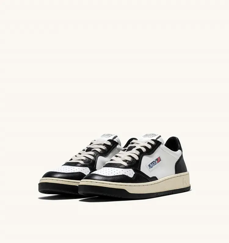 AUTRY SNEAKERS MEDALIST LOW SNEAKERS IN TWO-TONE LEATHER WHITE AND BLACK